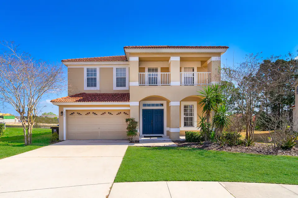 A view at the two story house with a small lawn in the front