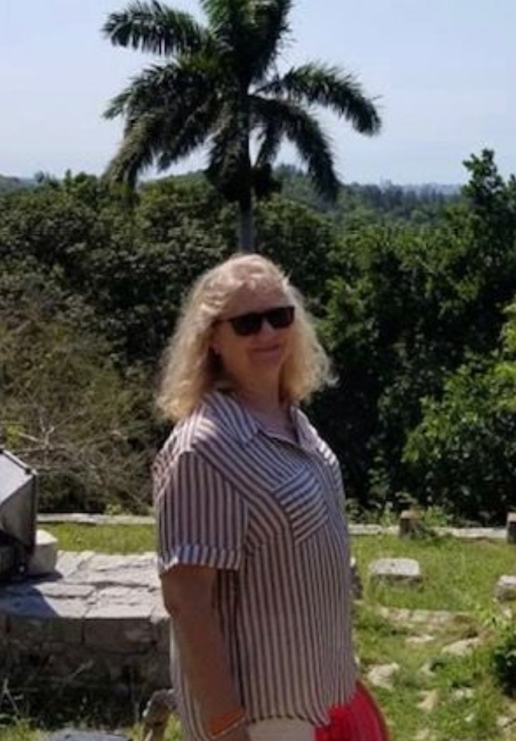 blonde woman wearing pinstriped shirt